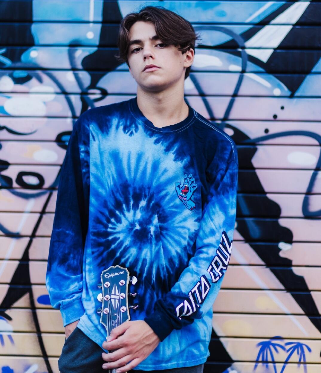 Heartfelt and Poignant Lyricism meets soulful Acoustic Arrangement: Up-and-Coming Artist Kid Prexy Enthralls All